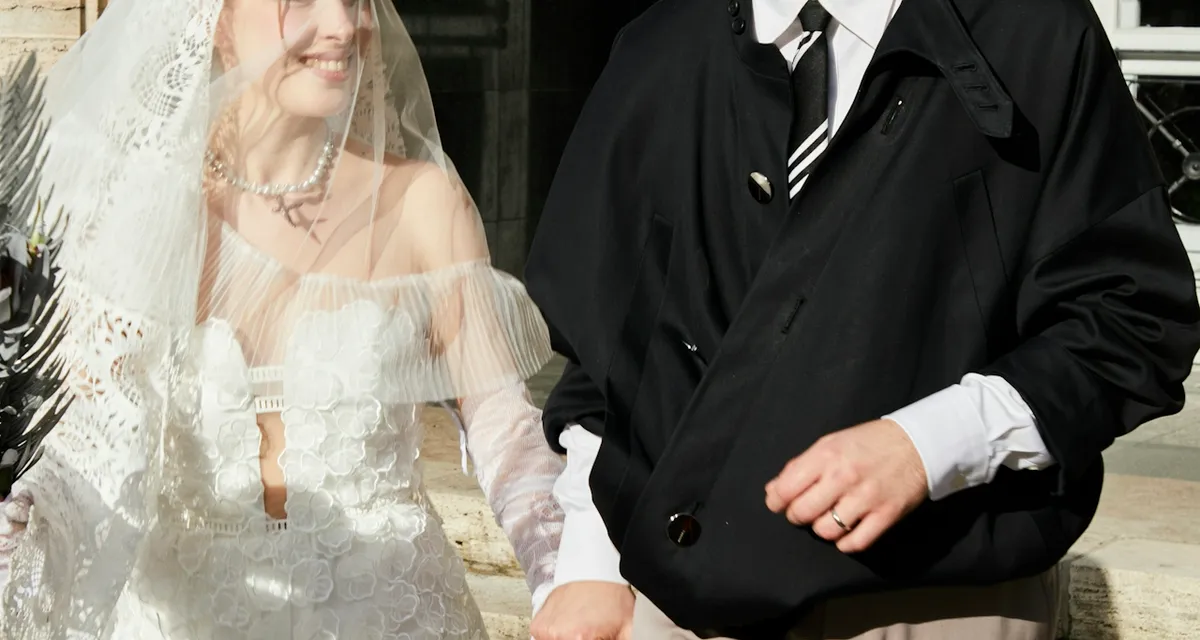 A couple walking together on their wedding day