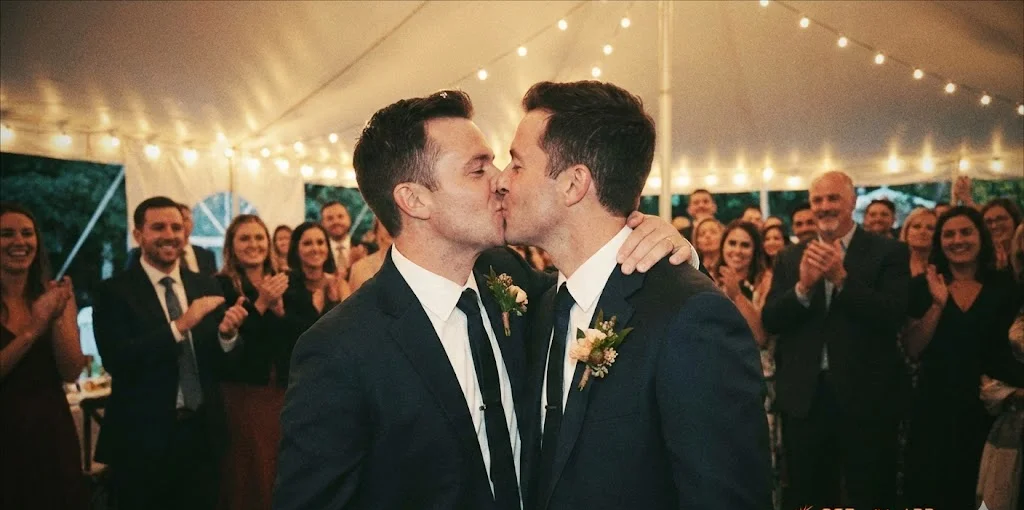 Couple sharing a kiss at their wedding reception